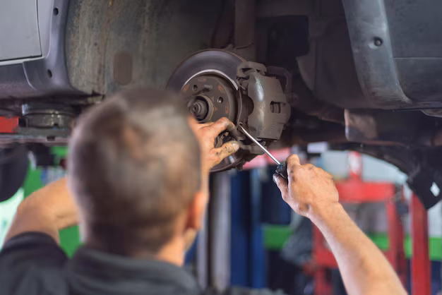 Mechanic doing wheel maintenance